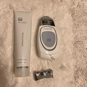 NuSkin Facial Spa- conductive gel and additional attachment.